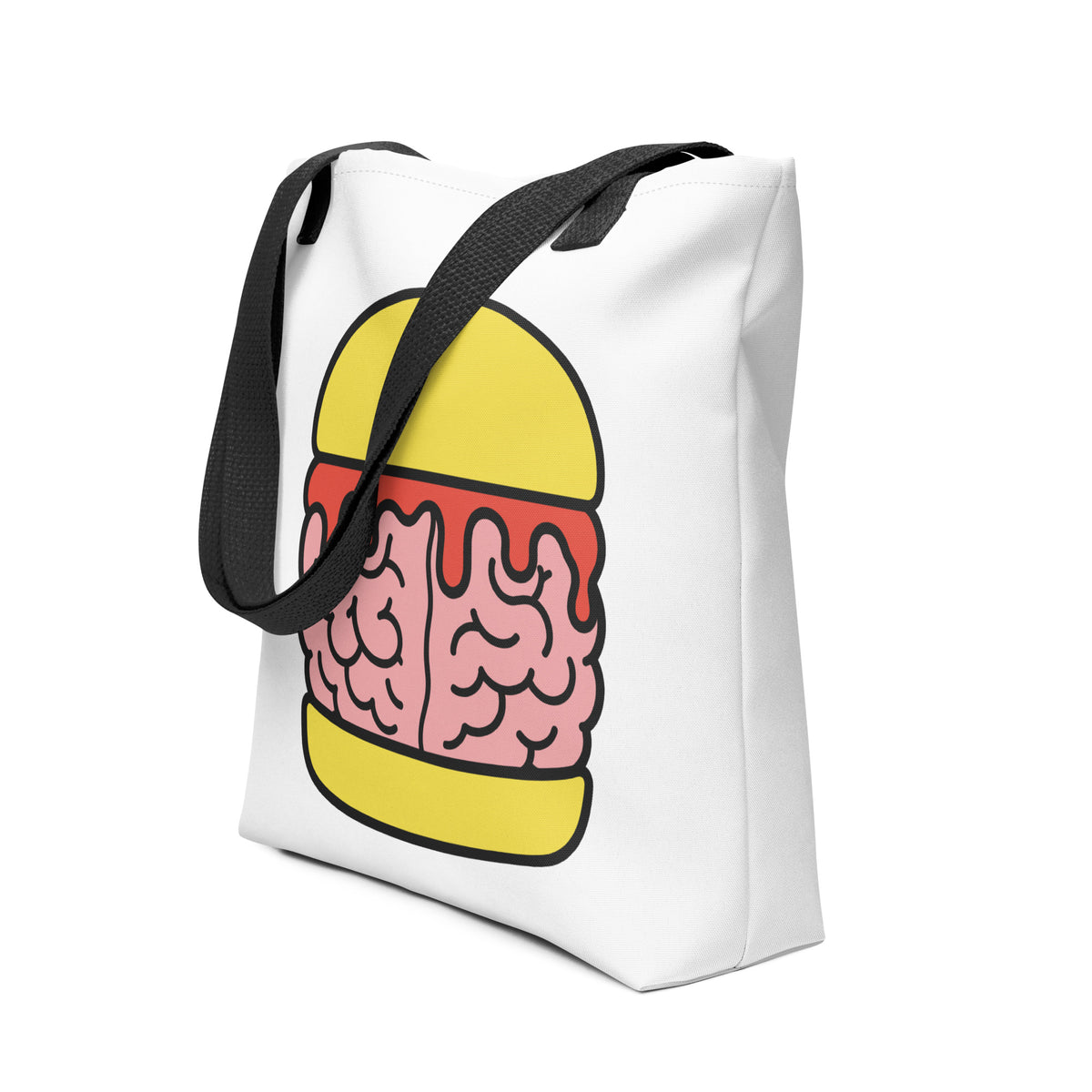 Angled view of the Trees, Rivers & UFOs Brain Burger Tote Bag showing the colourful brain burger graphic, white fabric and black handles.