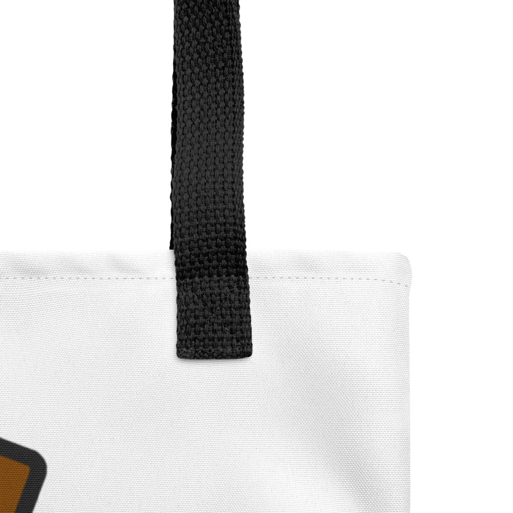Close-up of the Brain Cream Tote Bag by Trees, Rivers & UFOs showing the black woven handle, stitching and white fabric.