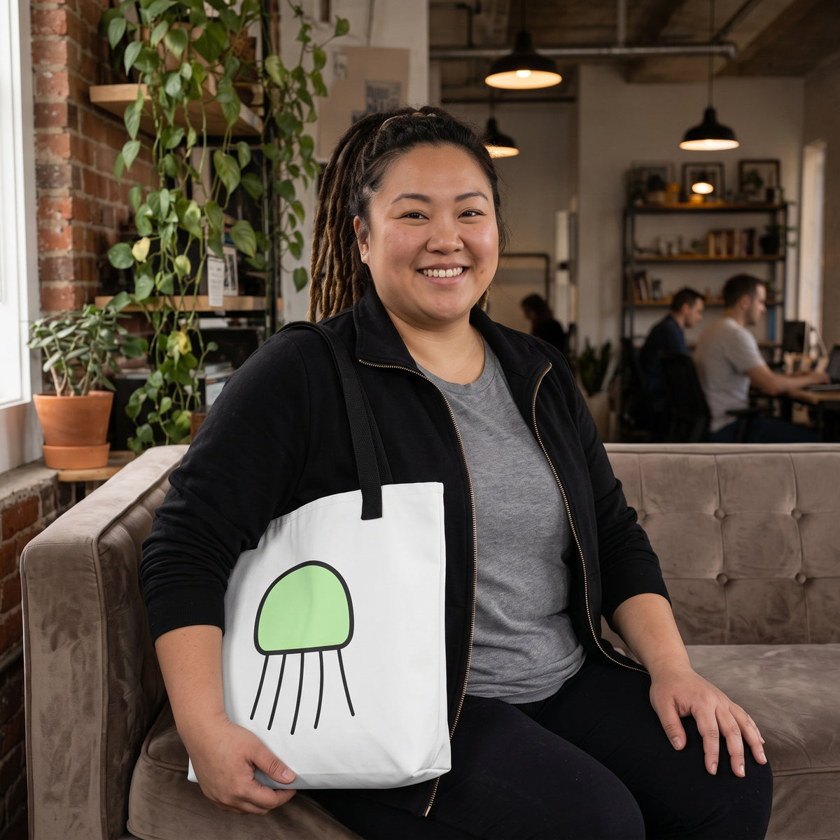 Woman holding the Forest Jellyfish tote bag by Trees, Rivers & UFOs.