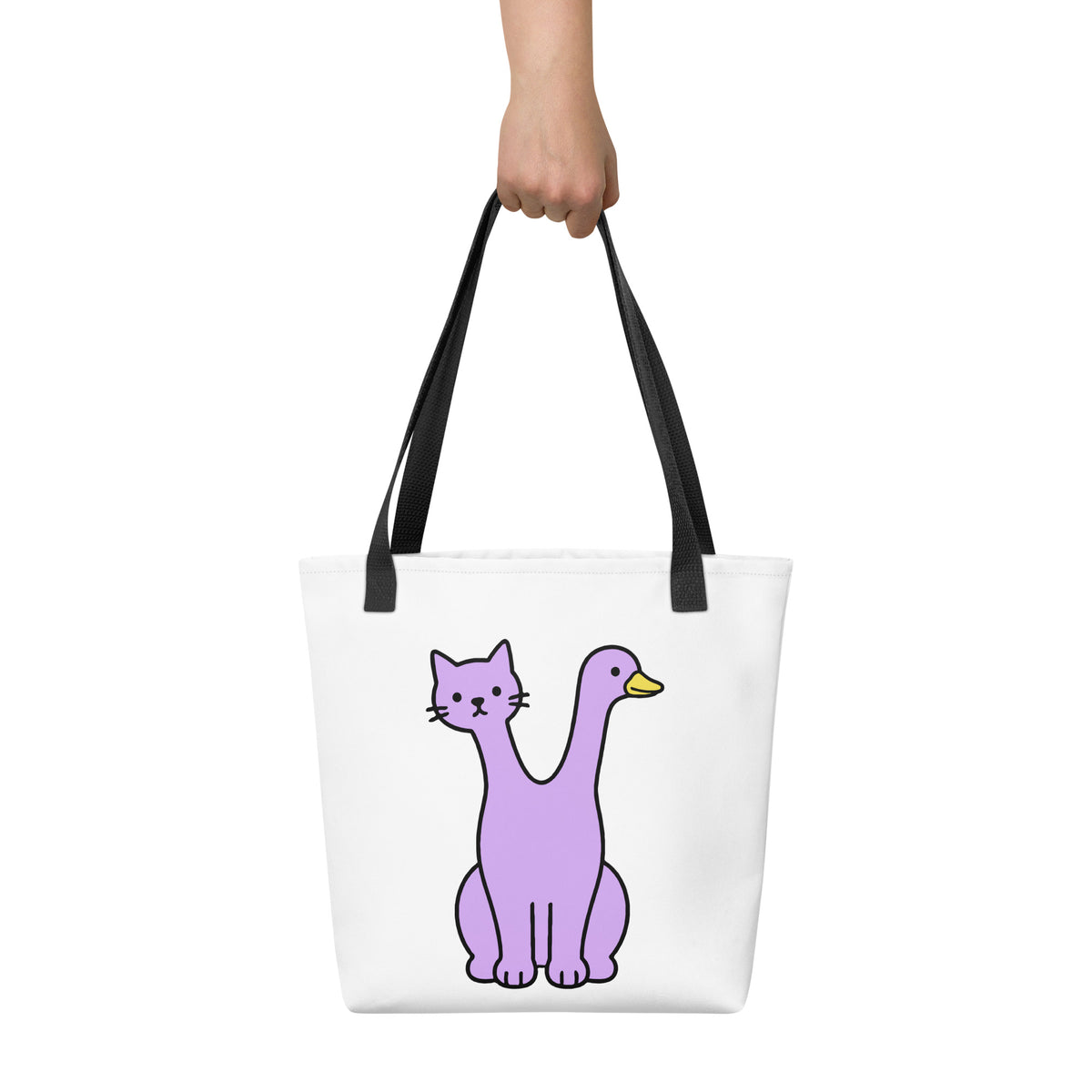 Front view of the Quackcat Tote Bag by Trees, Rivers & UFOs with black handles and original purple two-headed cat and duck artwork.